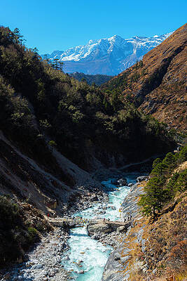 Bridge Wall Art featuring the photograph River Crossing By Tengboche by Owen Weber