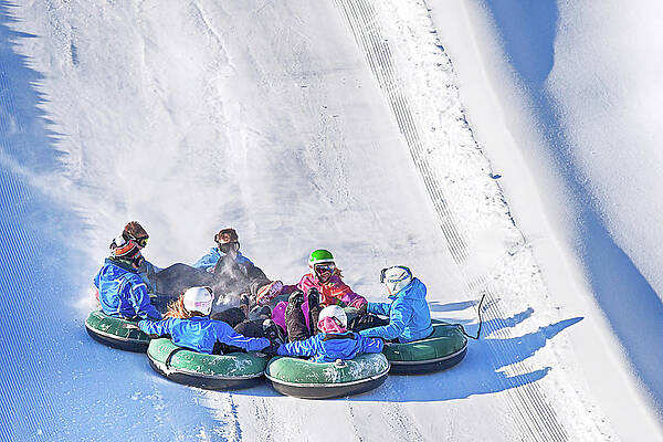 Winter Wall Art featuring the photograph Snow Tubing In Ontario, Canada by Tatiana Travelways
