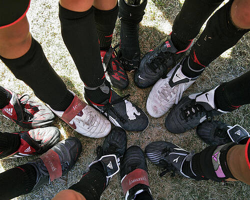 Team Huddle with Soccer Cleats Wall Art