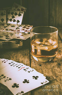 Cards and Whiskey on Wooden Table Photograph
