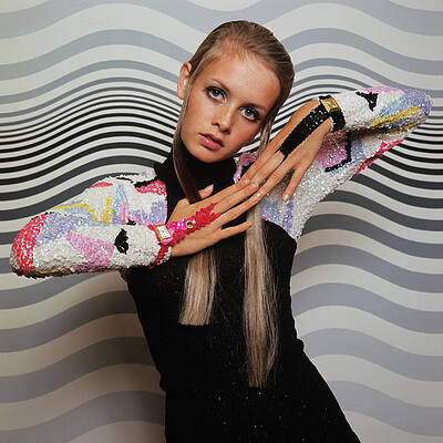 Sixties Fashion Icon in Colorful Attire Photograph