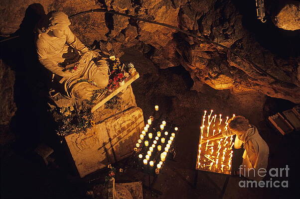 Wall Art featuring the photograph Woman Burning Candle At Troglodyte Sainte-Marie Madeleine Holy Cave by Sami Sarkis Photography