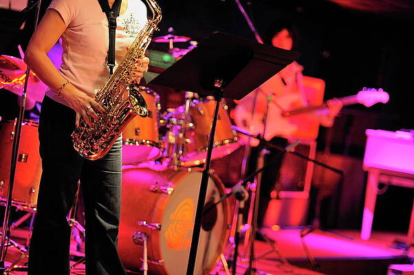 Europe Photograph - Woman Playing Saxophone On Stage With Her Band by Sami Sarkis Photography