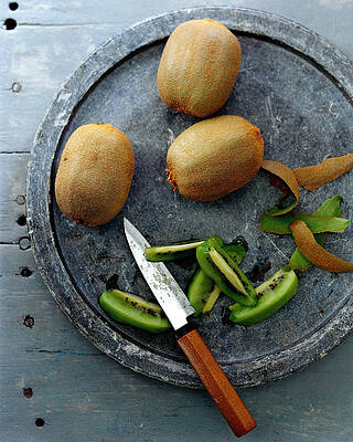 Plate Wall Art featuring the photograph A Plate Of Kiwifuit by Romulo Yanes