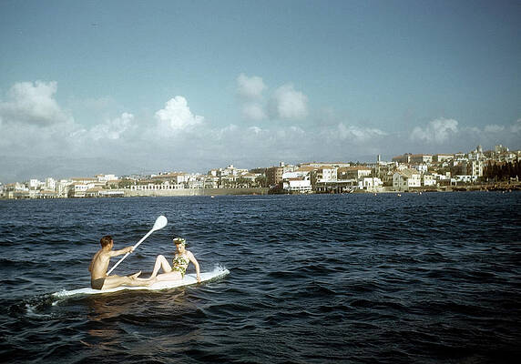 Paddleboarding by Coastal Town Wall Art
