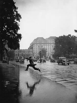 Man Leaping on Rainy Day Wall Art