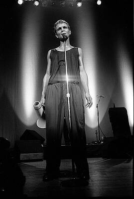 Singer on Stage in Dramatic Lighting Wall Art
