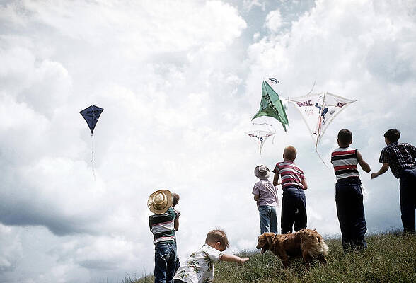 Wall Art featuring the photograph Kids Fly Kites #1 by Michael Ochs Archives