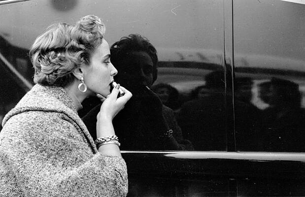 Woman Applies Makeup Using Car Reflection Wall Art