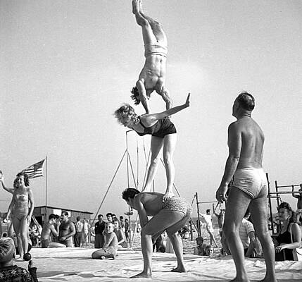 Acrobats Performing on the Beach Wall Art