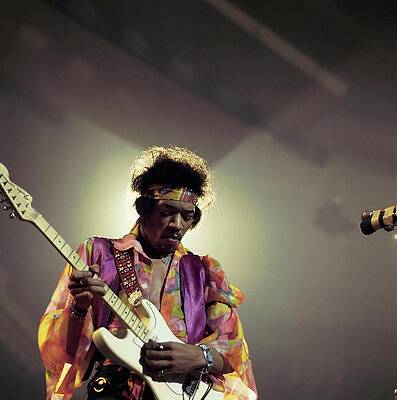 Guitarist on Stage with Vibrant Attire Photograph