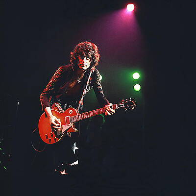 Guitarist Performing Live on Stage Photograph
