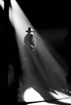 Singer on Stage with Dramatic Lighting Wall Art