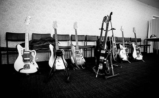 Collection of Electric Guitars in a Room Wall Art