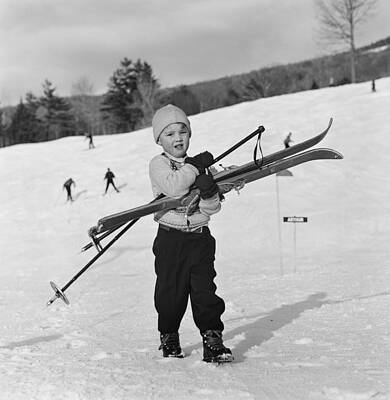 Child Holding Skis on Snowy Slope Wall Art