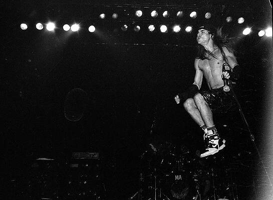 Energetic Rock Performance on Stage Wall Art
