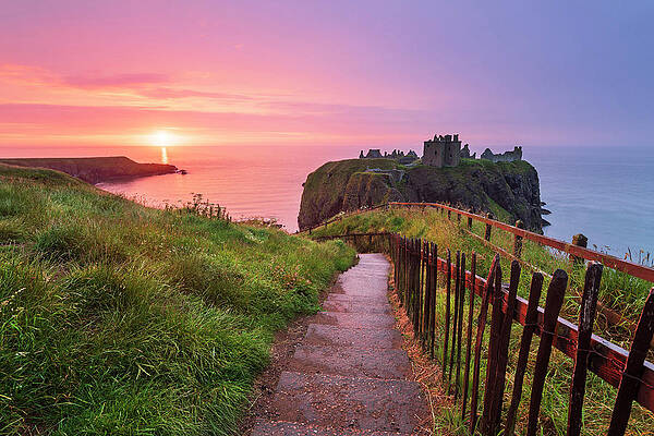 British Wall Art featuring the digital art United Kingdom, Scotland, Aberdeenshire, Stonehaven, Dunnottar Castle, Great Britain, British Isles, Colorful Sunrise Over The Ruins Of Dunnottar Castle Along The Scottish Coastline #2 by Luigi Vaccarella
