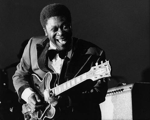 Blues Legend Playing Guitar Onstage Photograph