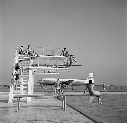 Vintage Poolside Scene with Plane Wall Art