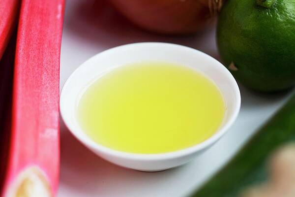 A Bowl Of Oil With Rhubarb And Limes Print