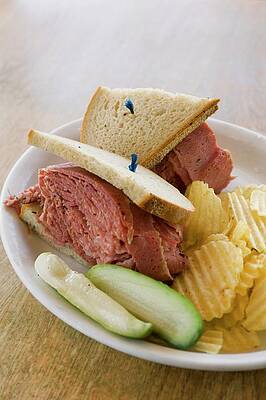 A Corned Beef Sandwich With Crisps And Pickled Gherkins Print