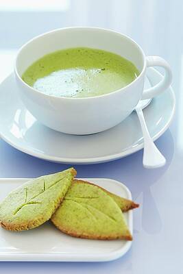 A Cup Of Matcha Tea With Leaf-shaped Matcha Biscuits Print