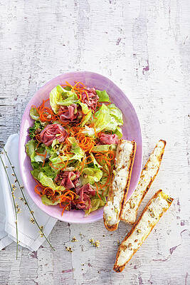 A Green Salad With Roast Beef, And Bread Topped With Goat's Cheese And Pistachios Print