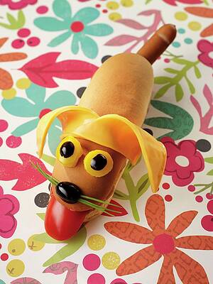 A Hot Dog With A Smiling Dog's Face Print