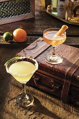 A Margarita Cocktail And A Manhattan Cocktail On An Old Suitcase Print