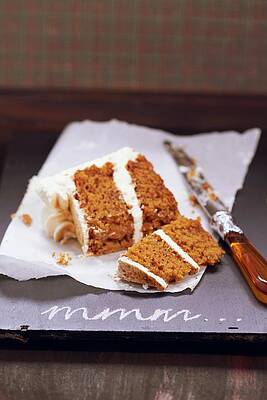 A Slice Of Carrot Cake With Cream Cheese Frosting, Cut In Two Pieces Print