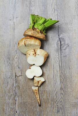 A Sliced Raw Sugar Beet On A Wooden Surface Print