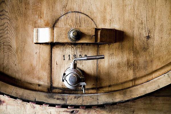 A Wooden Barrel With A Metal Tap Print