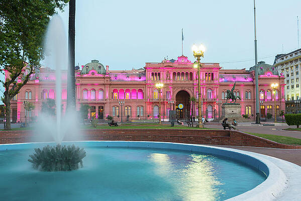 Fountain Wall Art featuring the digital art Argentina, Buenos Aires, Plaza De Mayo, Fountain And Casa Rosada Illuminated At Dusk by Jordan Banks