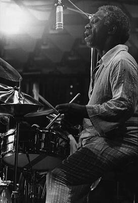 Drummer Performing Live on Stage Photograph