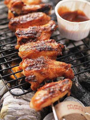 Barbecued Chicken Wings And Barbecue Sauce On The Barbecue Print