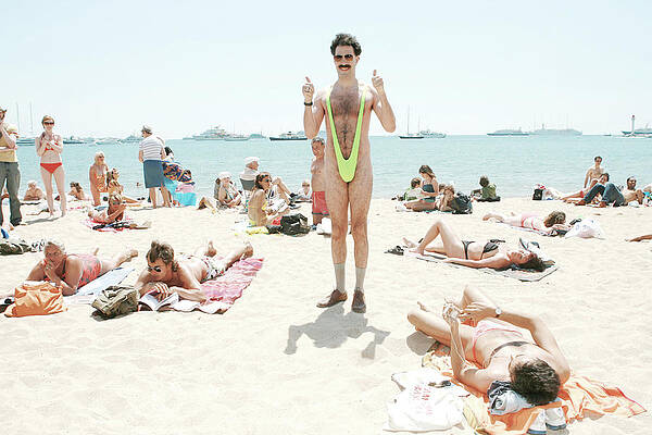 Comedian in Green Swimsuit on Beach Wall Art