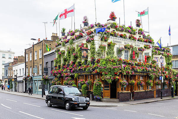 British Wall Art featuring the digital art Churchill Arms Pub, London, England by Andrea Armellin