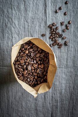 Coffee Beans In A Paper Bag On A Grey Linen Cloth Print
