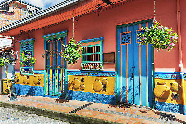 Facade Wall Art featuring the digital art Colombia, Colorful Facade In Guatape Town Near Medellin by Claudia Uripos