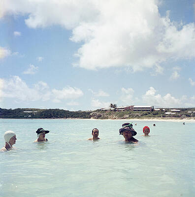 Group of Swimmers in Tranquil Sea Wall Art
