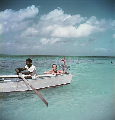 Men Rowing in Clear Blue Waters Wall Art