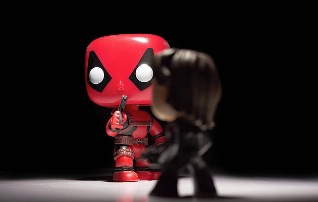 Isolate Wall Art featuring the photograph Deadpool Vs Bucky by Scott Lyons