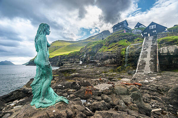 Building Wall Art featuring the digital art Denmark, Faeroe Islands, Kalsoy, Mikladalur, The Iconic Statue Kopakonan by Stefano Coltelli