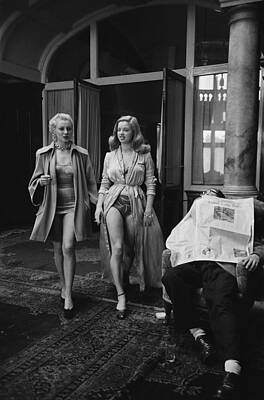 Two Women Walking in Stylish Outfits Wall Art