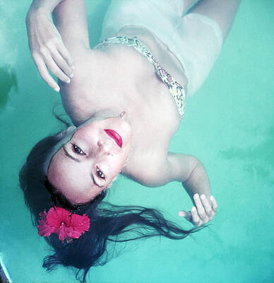 Woman Floating in Swimming Pool Wall Art