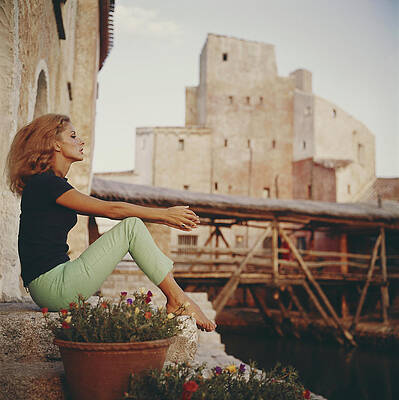 Woman Relaxing by Rustic Architecture Wall Art