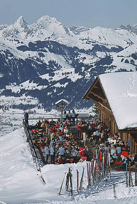 Skiers Relaxing at a Snowy Lodge Wall Art