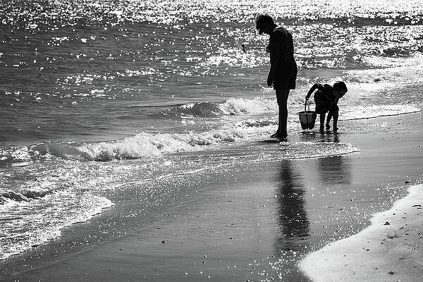 Wall Art featuring the photograph Florida Beach Combers by Jeff Phillippi