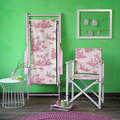Folding Chair With Toile-de-jouy Fabric Seat And Back In Front Of Green Wall Print