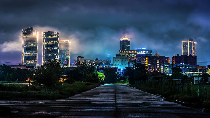 Cityscape with Glowing Skyscrapers at Night Photograph